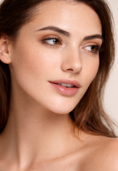 Close-up of a woman's face with a neutral background
