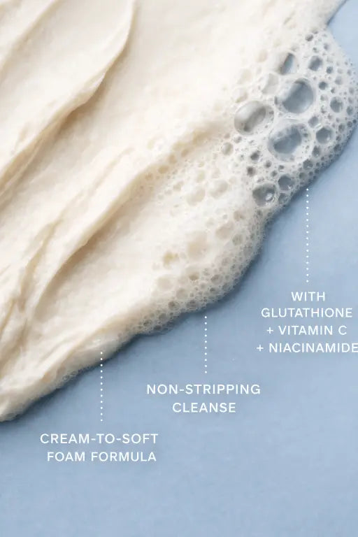 Foamy skincare product with text on a blue background