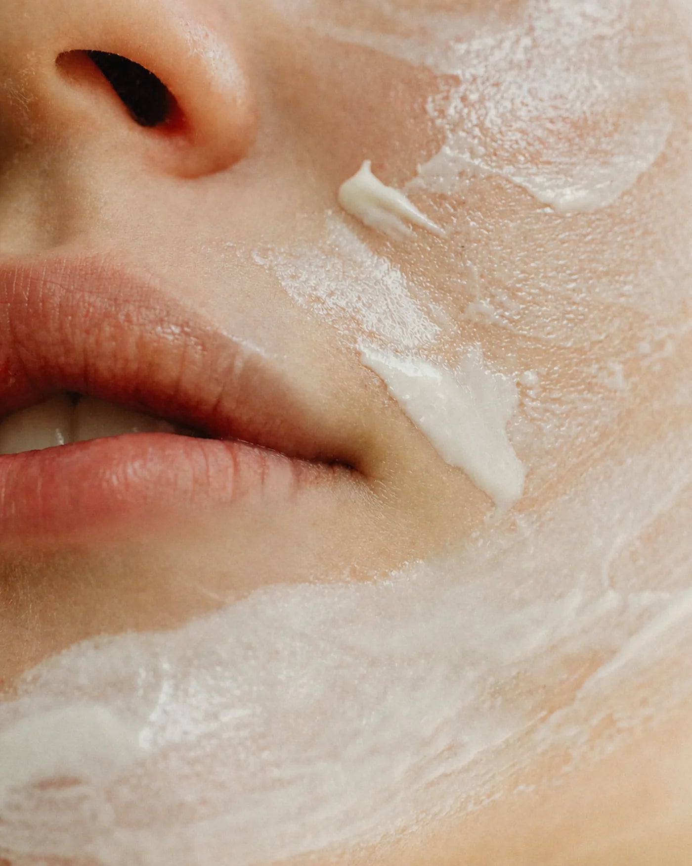 Close-up skincare cream application for Pakistani skin routine 2026